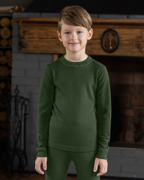 Boy wearing 100% Merino wool long sleeve shirt in the color dark green