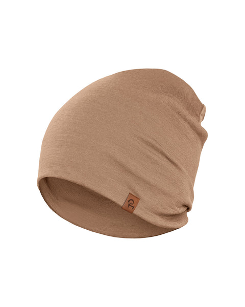 Close-up of beige merino wool beanie with minimalist design, lightweight breathable merino hat for everyday wear.