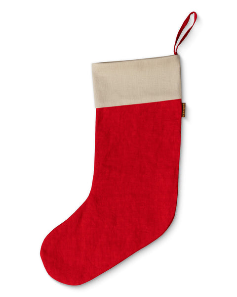 Rød julesok med beige top på hvid baggrund